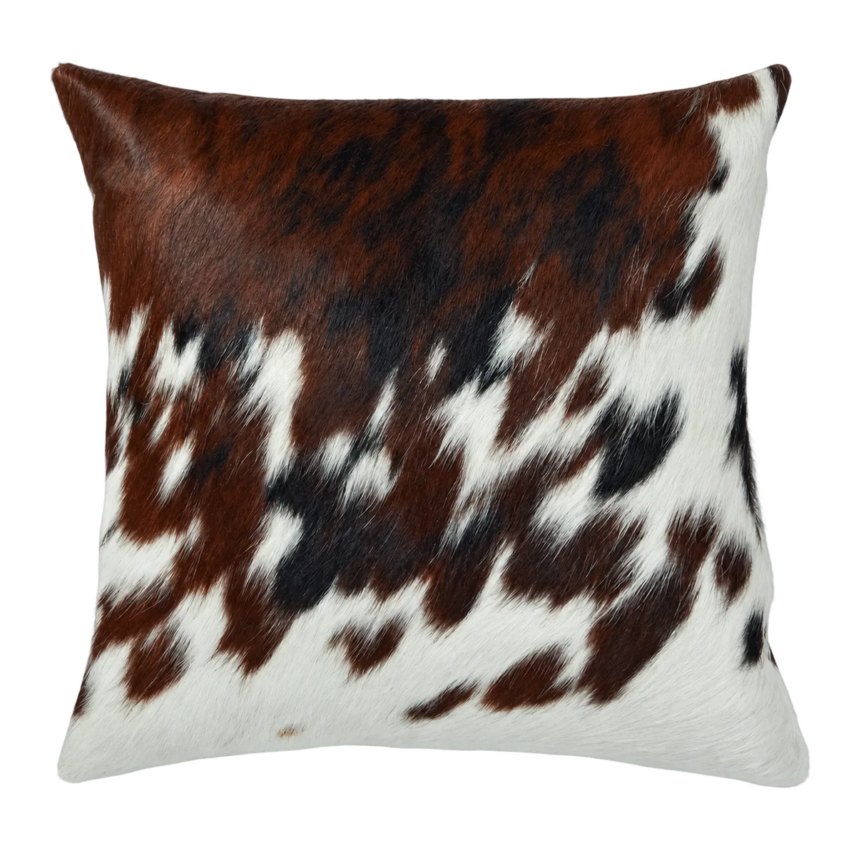 Coussin en peau de vache Braise mouchetée, vue du produit aux tonalités brun roux et blanc moucheté